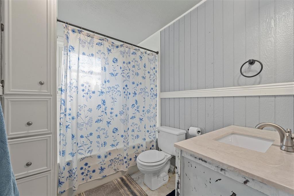 143 Crawford Mount Calm, TX 76673 - Photo 8 of 19 a bathroom with a sink toilet and shower