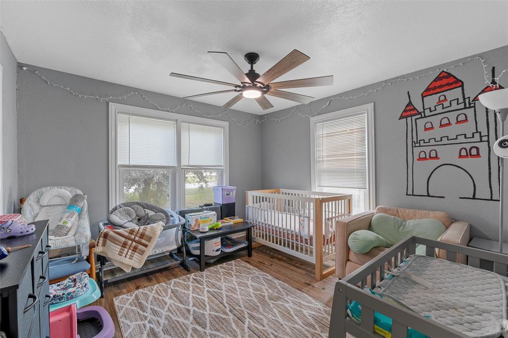 143 Crawford Mount Calm, TX 76673 - Photo 10 of 19 a bedroom with furniture and a window