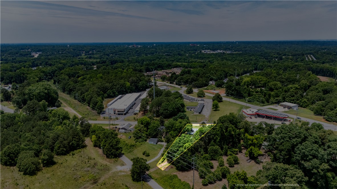 608 29 N Bypass Anderson, SC 29621 - Photo 16 of 20 An aerial perspective showcases a property's placement amidst a verdant landscape with essential commercial amenities nearby.