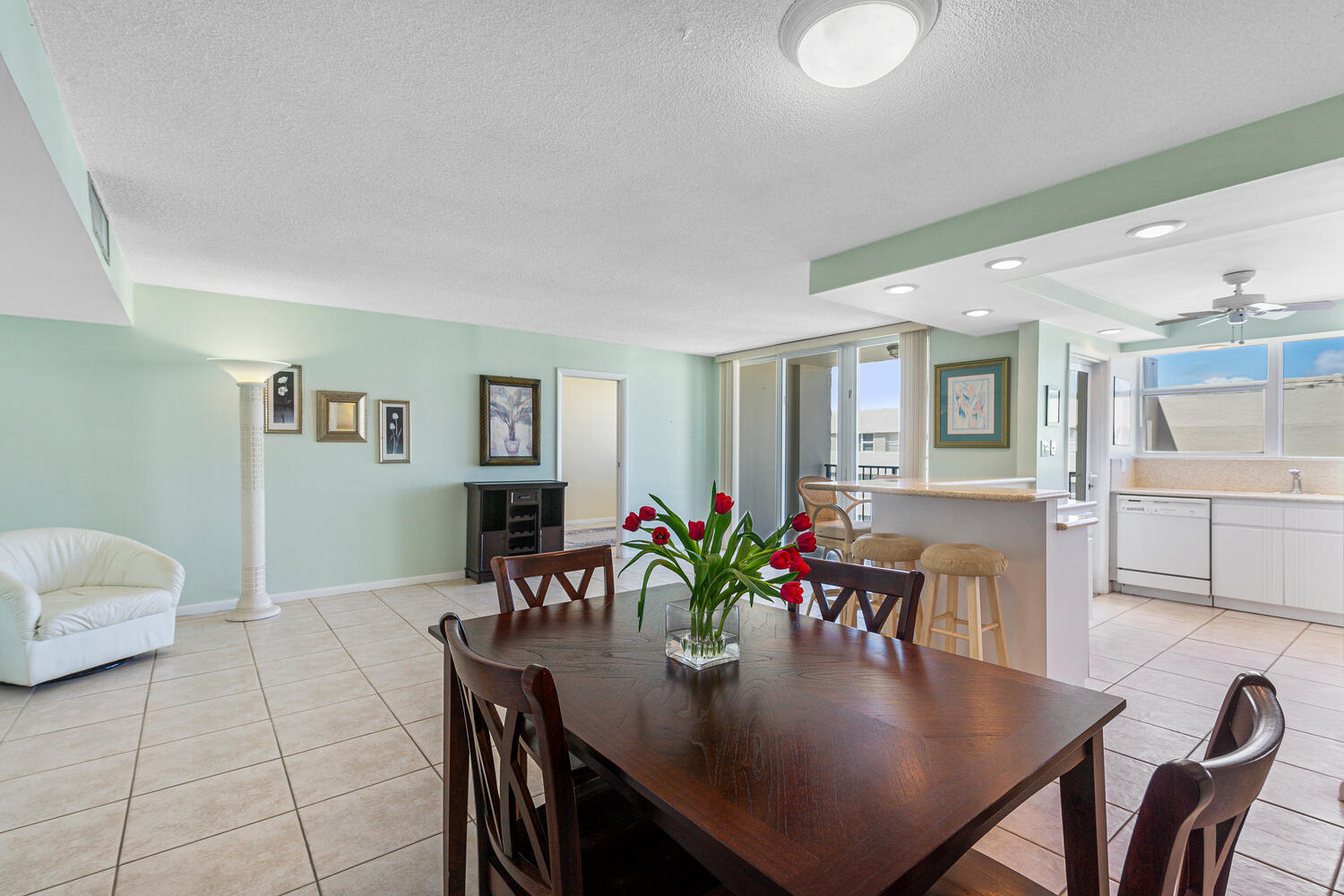 a view of a dining room with furniture and wooden floor