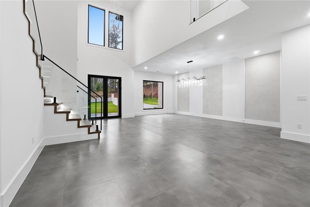 1563 Whitley Road Dacula, GA 30019 - Photo 5 of 44 a view of a hallway with wooden floor and stairs