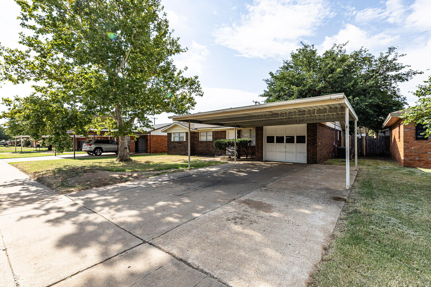 5517 16th Place Lubbock, TX 79416 - Photo 2 of 23 a view of a house with a yard