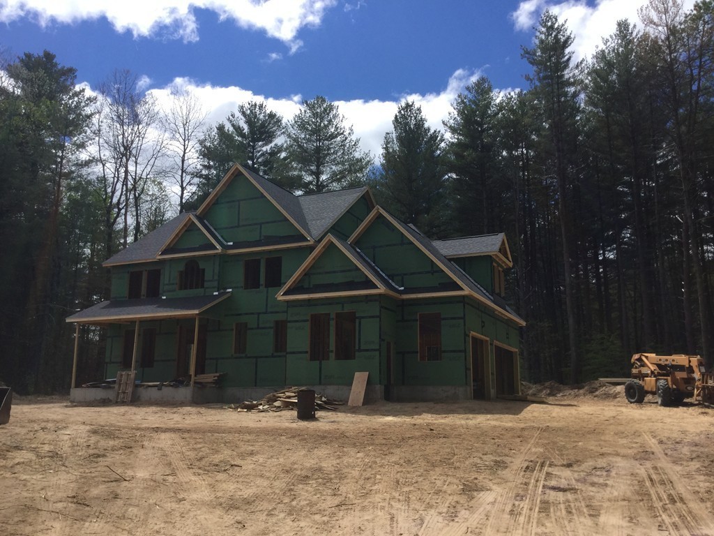 Lot 2 Cook Road Southampton, MA 01073 - Photo 3 of 13 a front view of a house with a yard and trees
