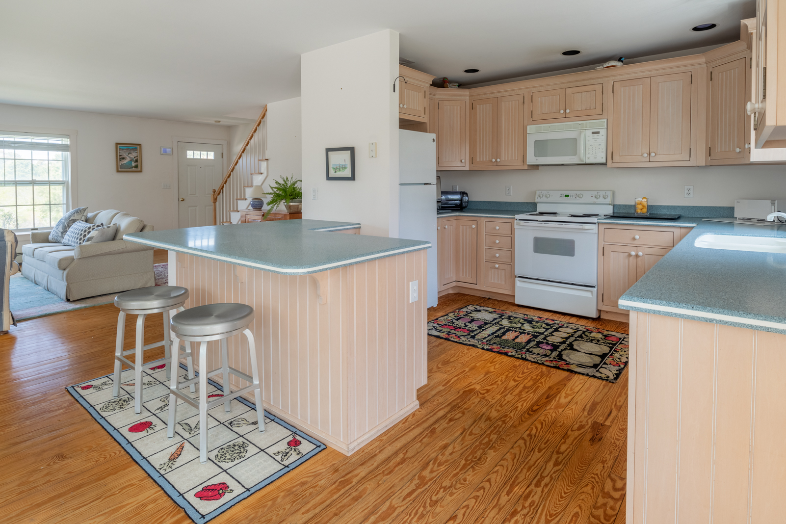 15 Swift Rock Road Nantucket, MA 02554 - Photo 12 of 32 a kitchen with stainless steel appliances granite countertop a sink and a stove