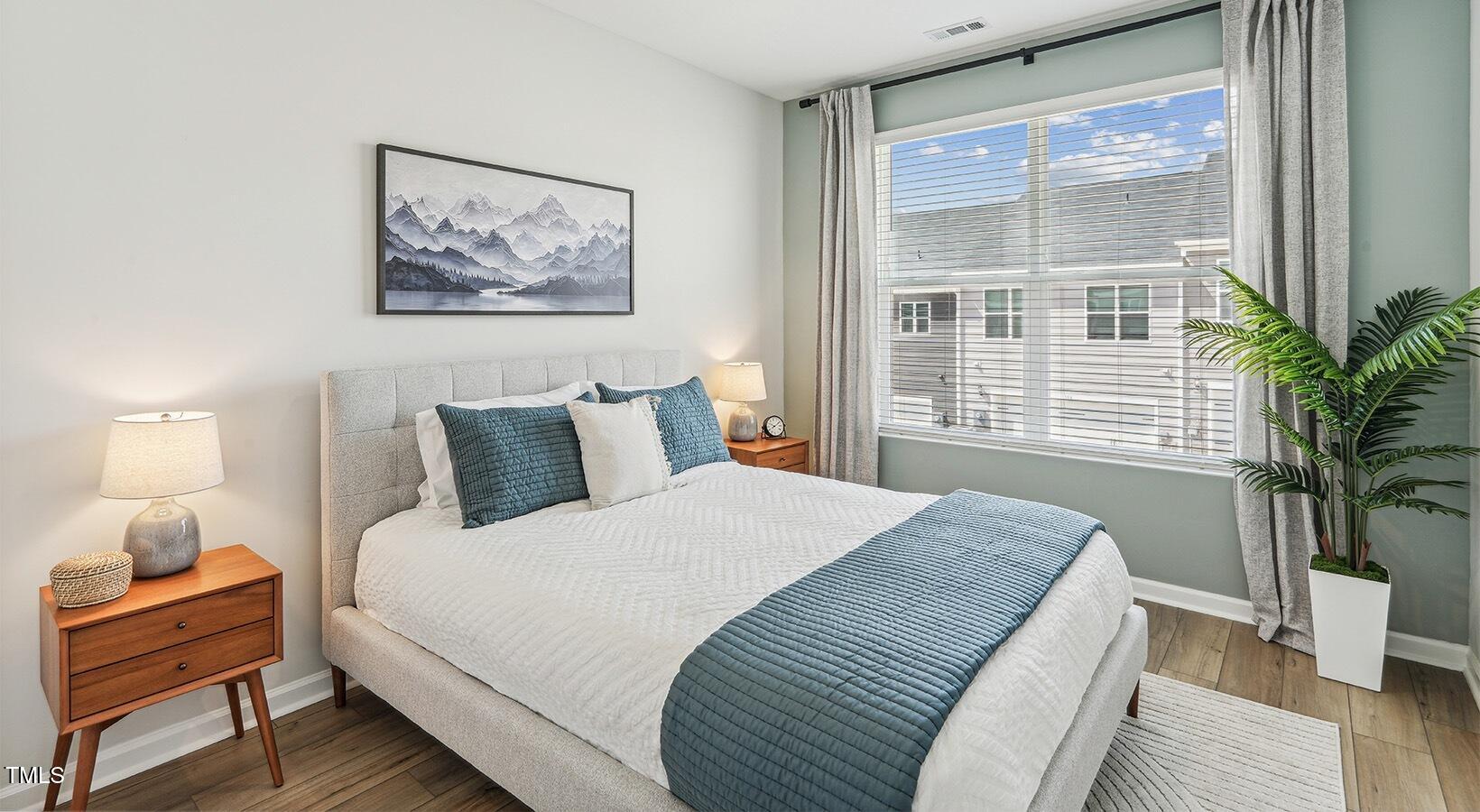 101 Decatur Drive Raleigh, NC 27603 - Photo 12 of 24 a bedroom with bed and a window