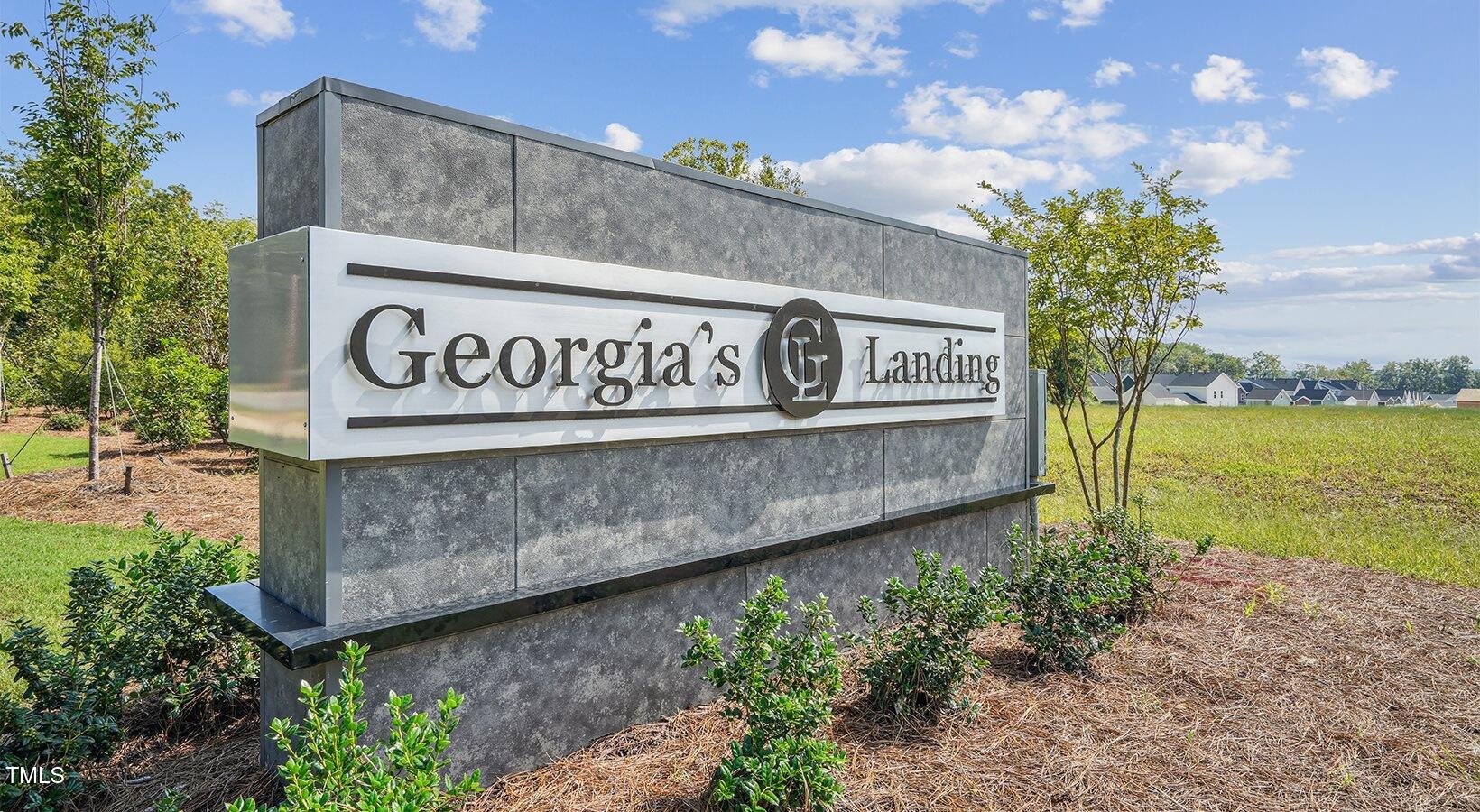 101 Decatur Drive Raleigh, NC 27603 - Photo 18 of 24 a street sign that is sitting in the middle of a building