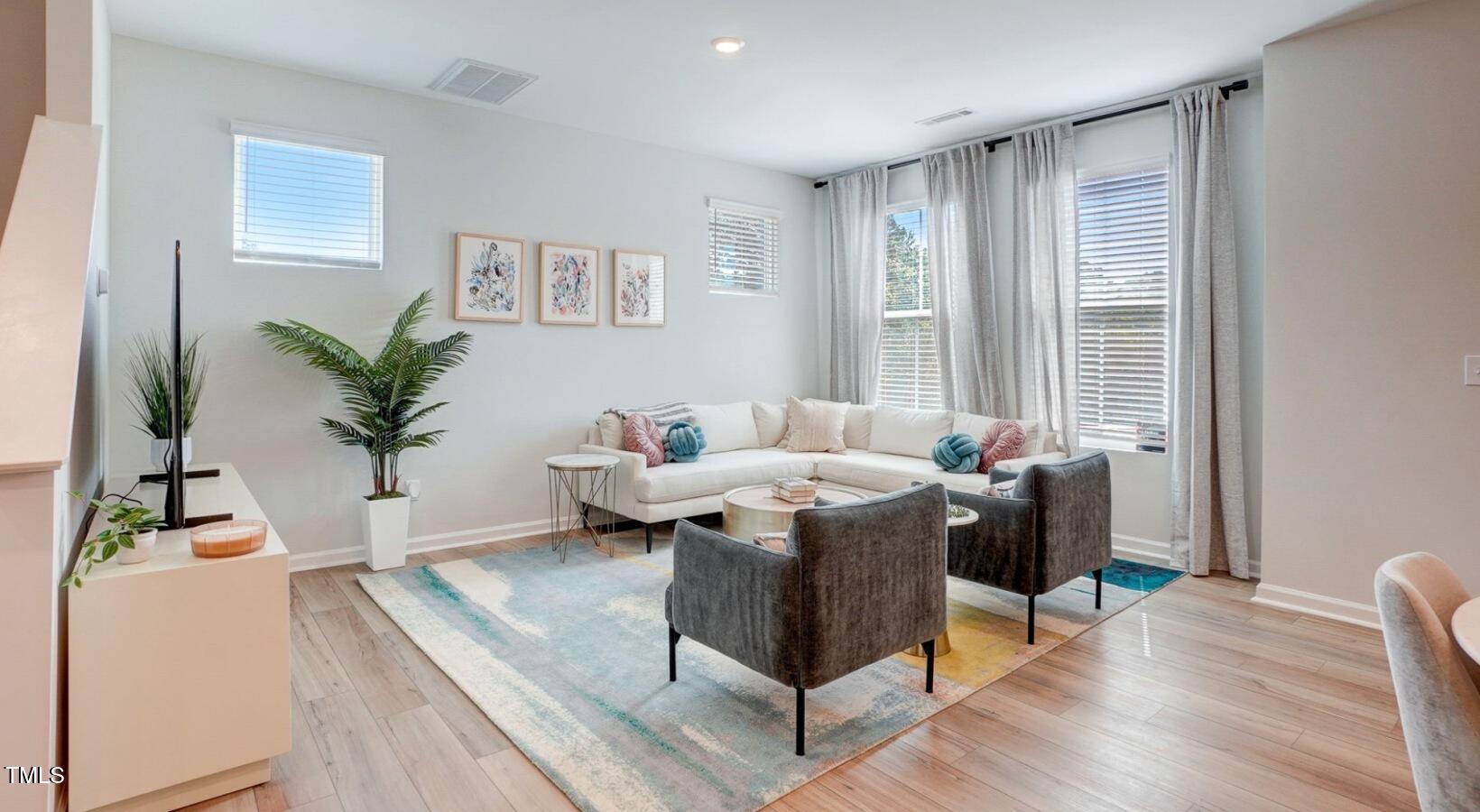 101 Decatur Drive Raleigh, NC 27603 - Photo 23 of 24 a view of a house with a table and chairs in a room