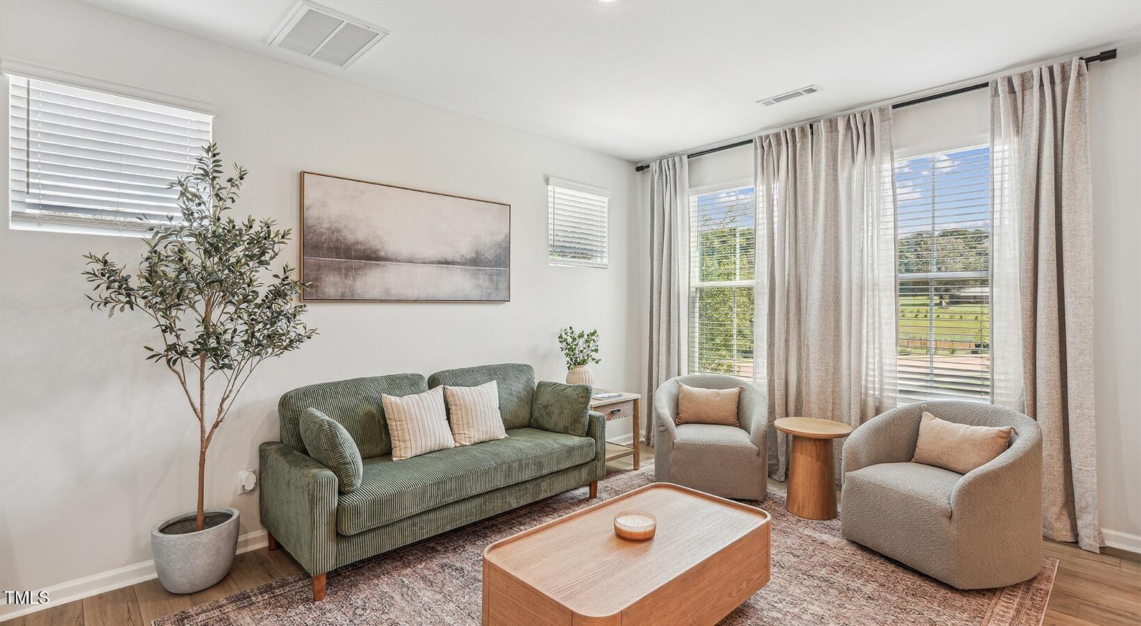 101 Decatur Drive Raleigh, NC 27603 - Photo 5 of 24 a living room with furniture and a large window