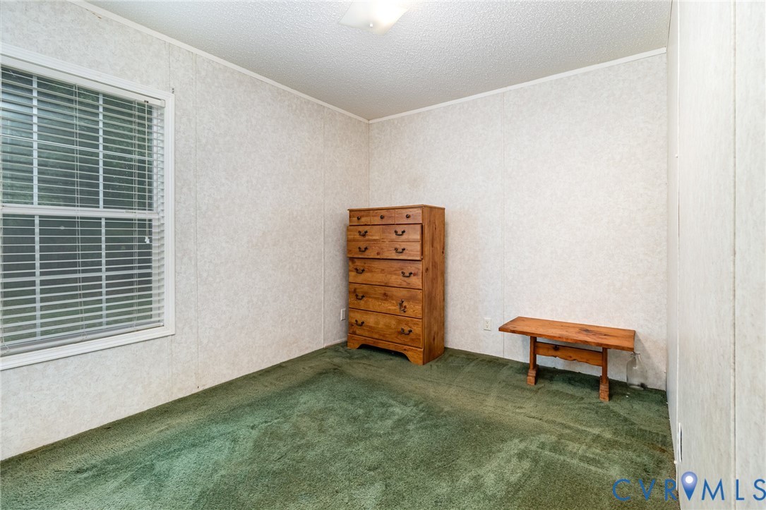 1292 Mt Prospect Road Laneview, VA 22504 - Photo 14 of 25 a room with a window and a chair