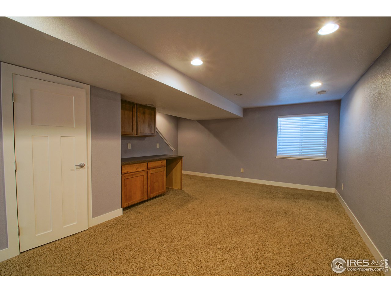 2008 Raven View Road Fort Collins, CO 80521 - Photo 20 of 36 3rd Bedroom in Finished Basement. Multi-purpose Room has built-ins, mini-bar and space for fridge. Has own Walk-in Closet and 3/4 Bathroom.