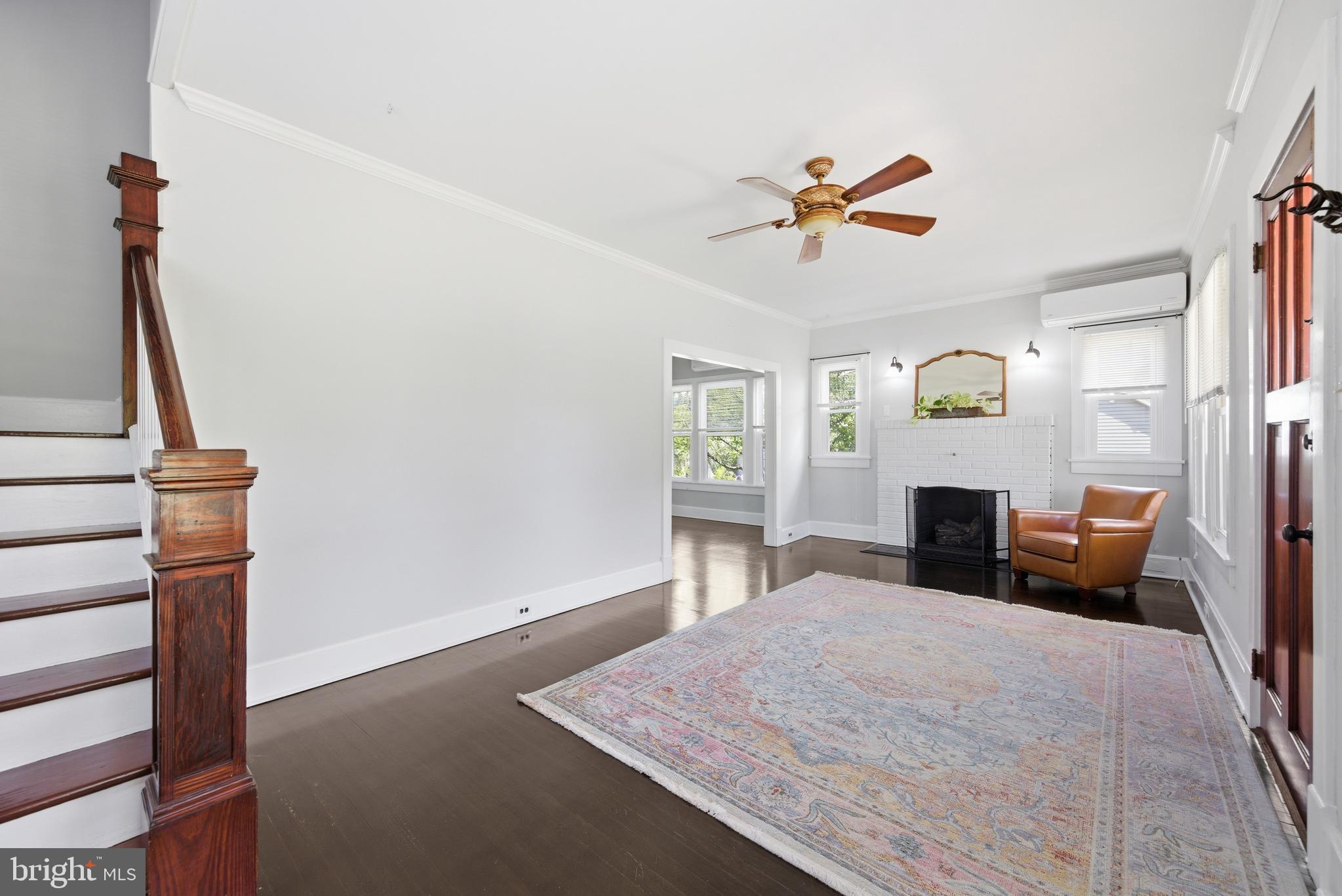 106 Main Street Preston, MD 21655 - Photo 5 of 31 a bedroom with a bed and a chandelier