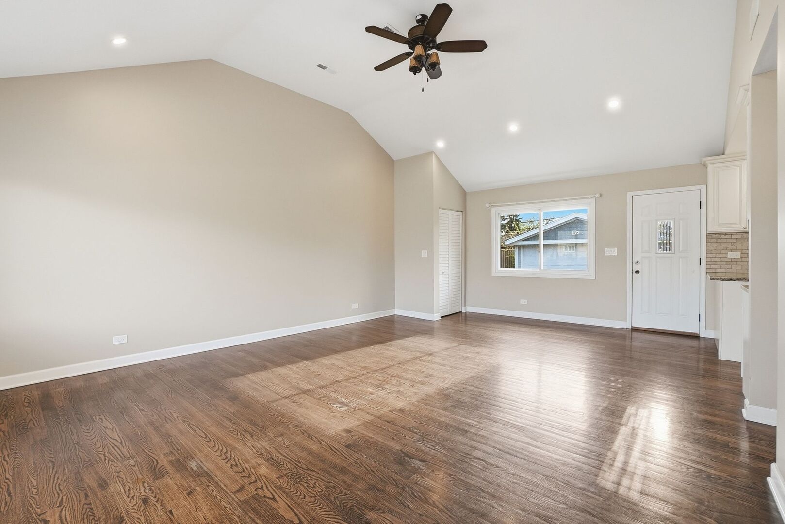8718 Cranbrook Lane Bridgeview, IL 60455 - Photo 14 of 24 wooden floor in an empty room with a window