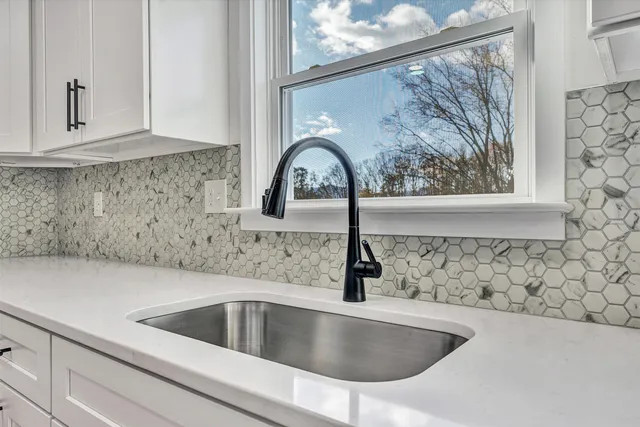 a view of a balcony with wooden floor