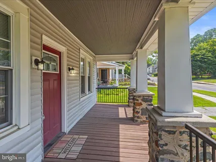 a view of a house with backyard sitting area and garden