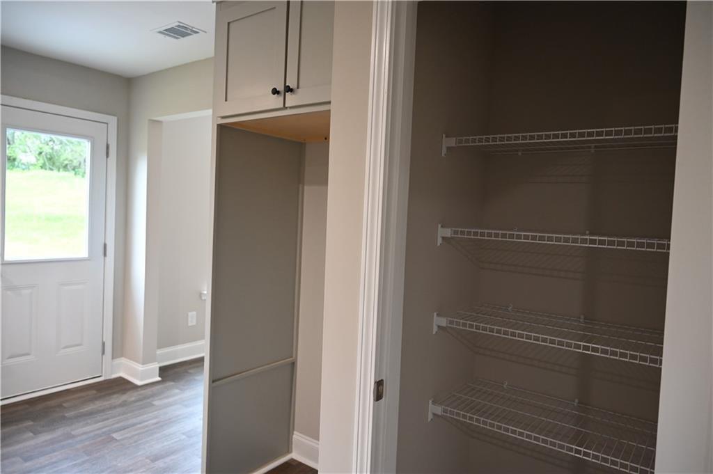 2970 Cannon Bridge Road Demorest, GA 30535 - Photo 14 of 36 a view of walk in closet with empty racks