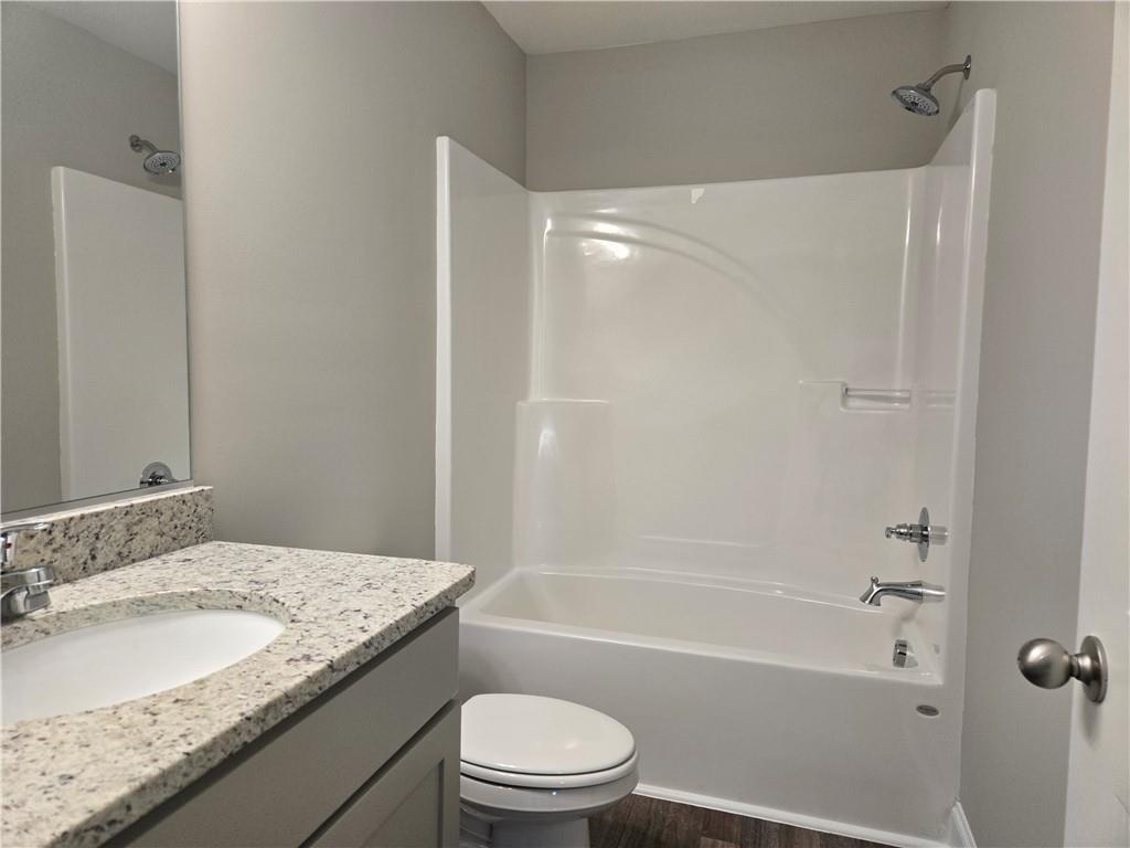 2970 Cannon Bridge Road Demorest, GA 30535 - Photo 35 of 36 a bathroom with a granite countertop sink toilet and shower