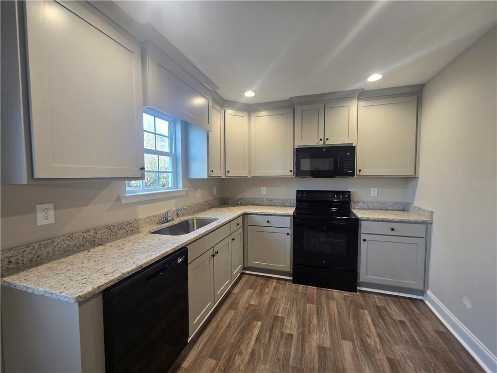 2970 Cannon Bridge Road Demorest, GA 30535 - Photo 9 of 36 a kitchen with a sink stove and refrigerator