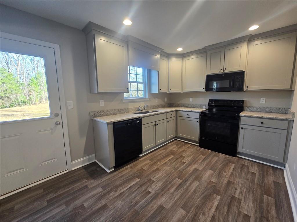 2970 Cannon Bridge Road Demorest, GA 30535 - Photo 10 of 36 a kitchen with stainless steel appliances granite countertop a stove a sink and a microwave