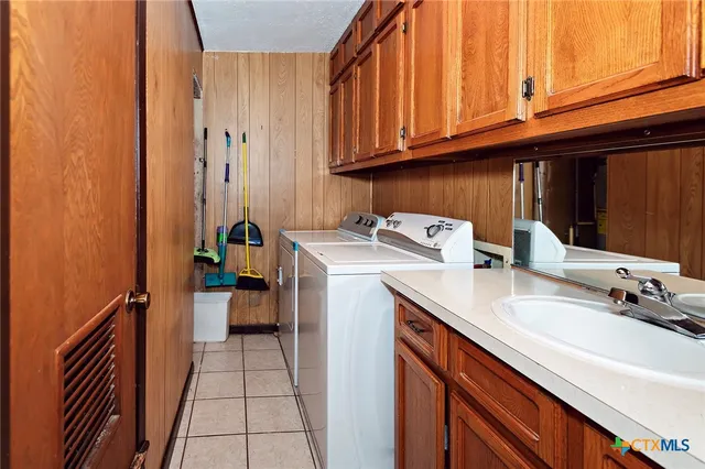 a view of a hallway with washer and dryer