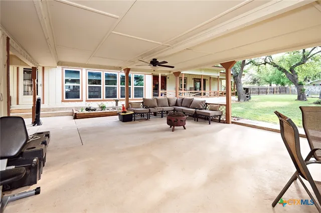 a view of a house with backyard and porch