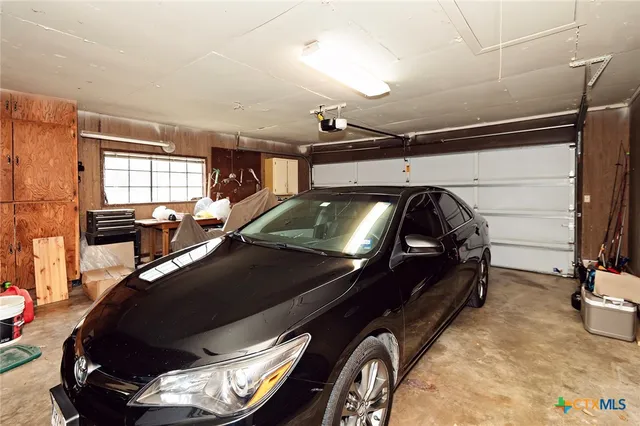 a view of a workspace with furniture