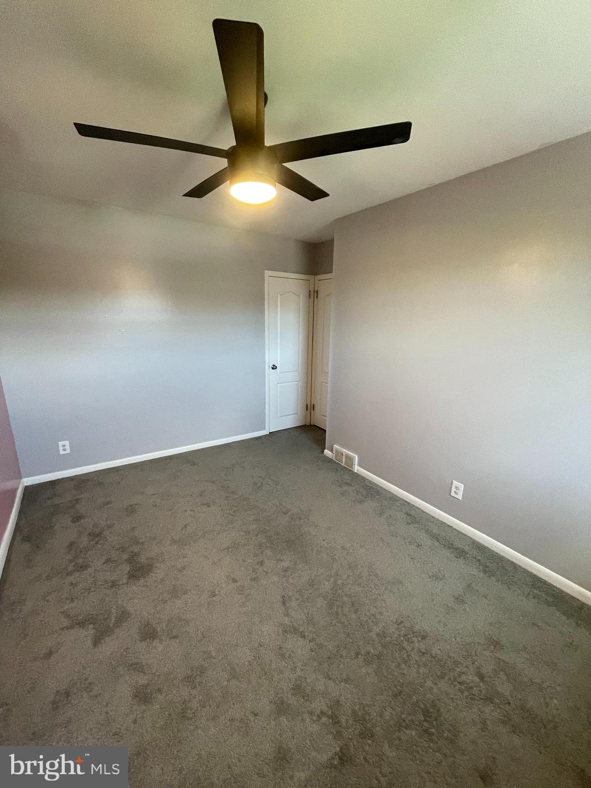 3349 Fairdale Road Philadelphia, PA 19154 - Photo 11 of 20 an empty room with a ceiling fan and a window
