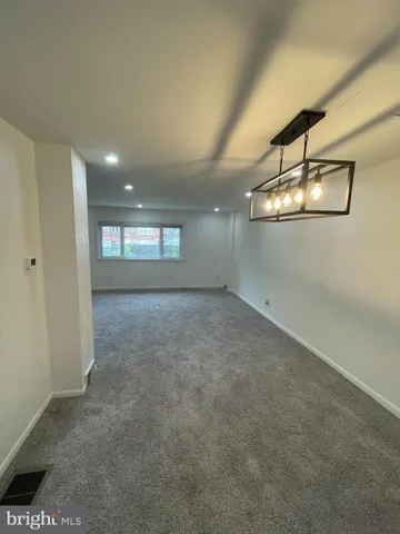 a view of empty room with windows