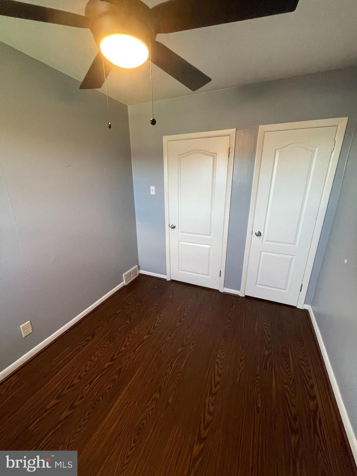 3349 Fairdale Road Philadelphia, PA 19154 - Photo 7 of 20 a view of an empty room with wooden floor and a window