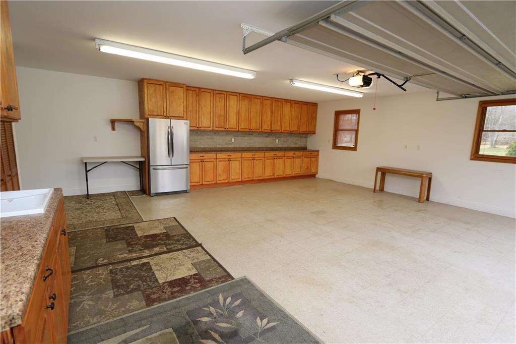 2143 Prospect Road Prospect, PA 16052 - Photo 23 of 25 Garage doubles as a small banquet hall with sink, 25' cabinets, countertop, and refrigerator!