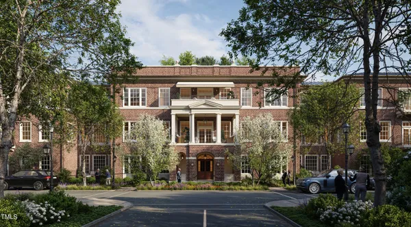 front view of a building with a garden