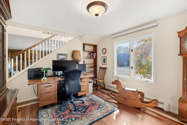 a workspace with furniture and a window