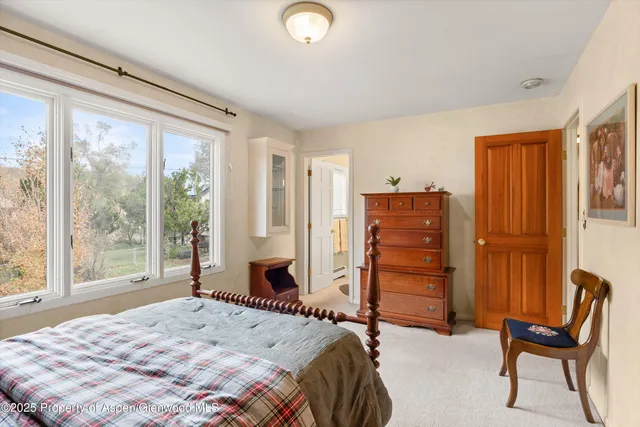 a bedroom with a bed and furniture