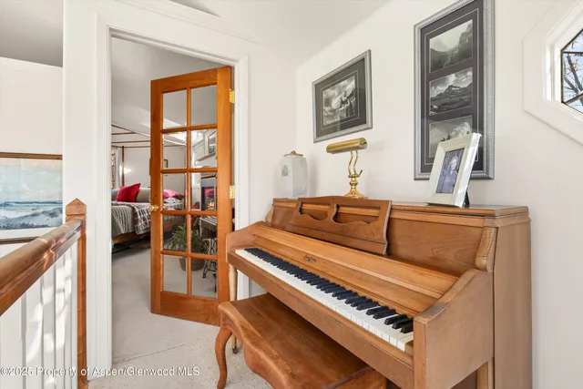 a living room with furniture a rug and a window