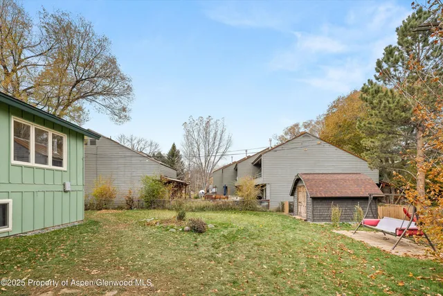 a house view with a backyard space