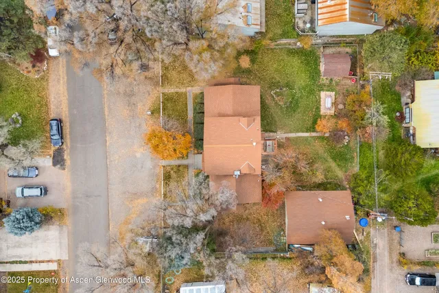 an aerial view of residential houses with outdoor space