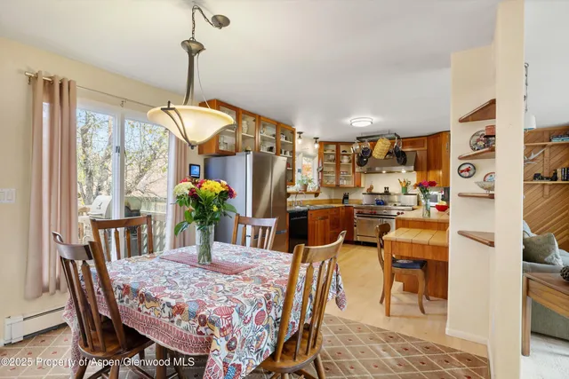 a dining room with furniture and window