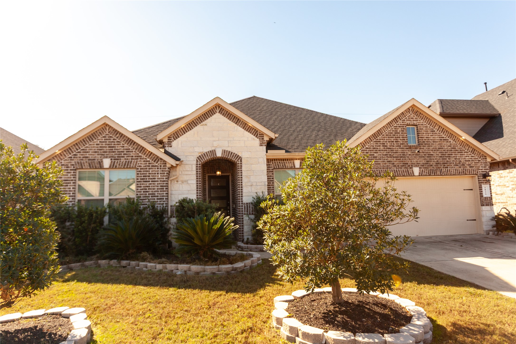 a front view of a house with garden