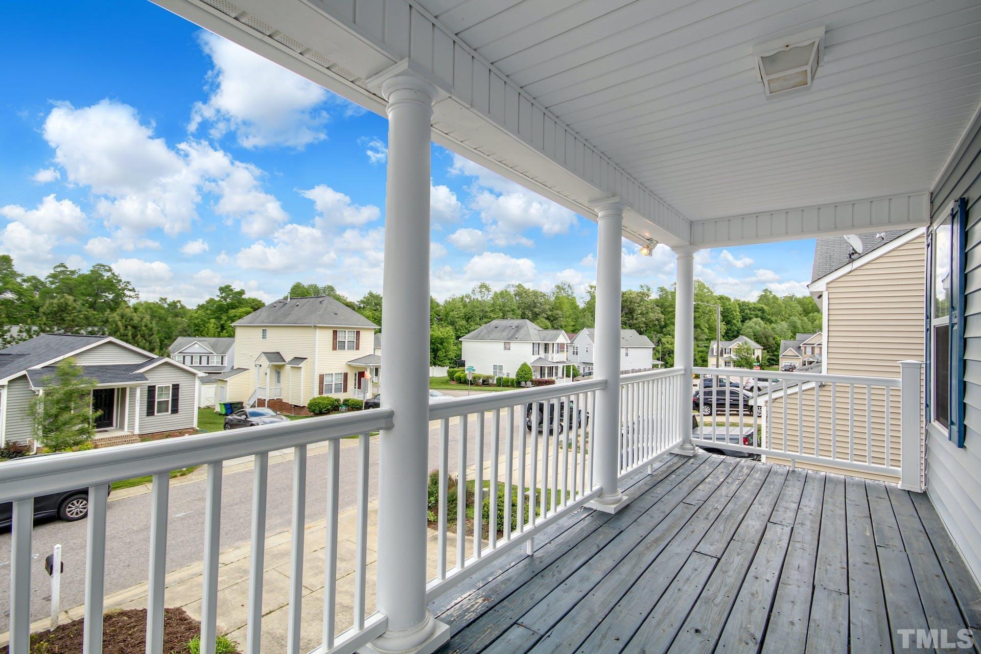 5852 Wynmore Road Raleigh, NC 27610 - Photo 12 of 25 a view of a balcony with wooden floor