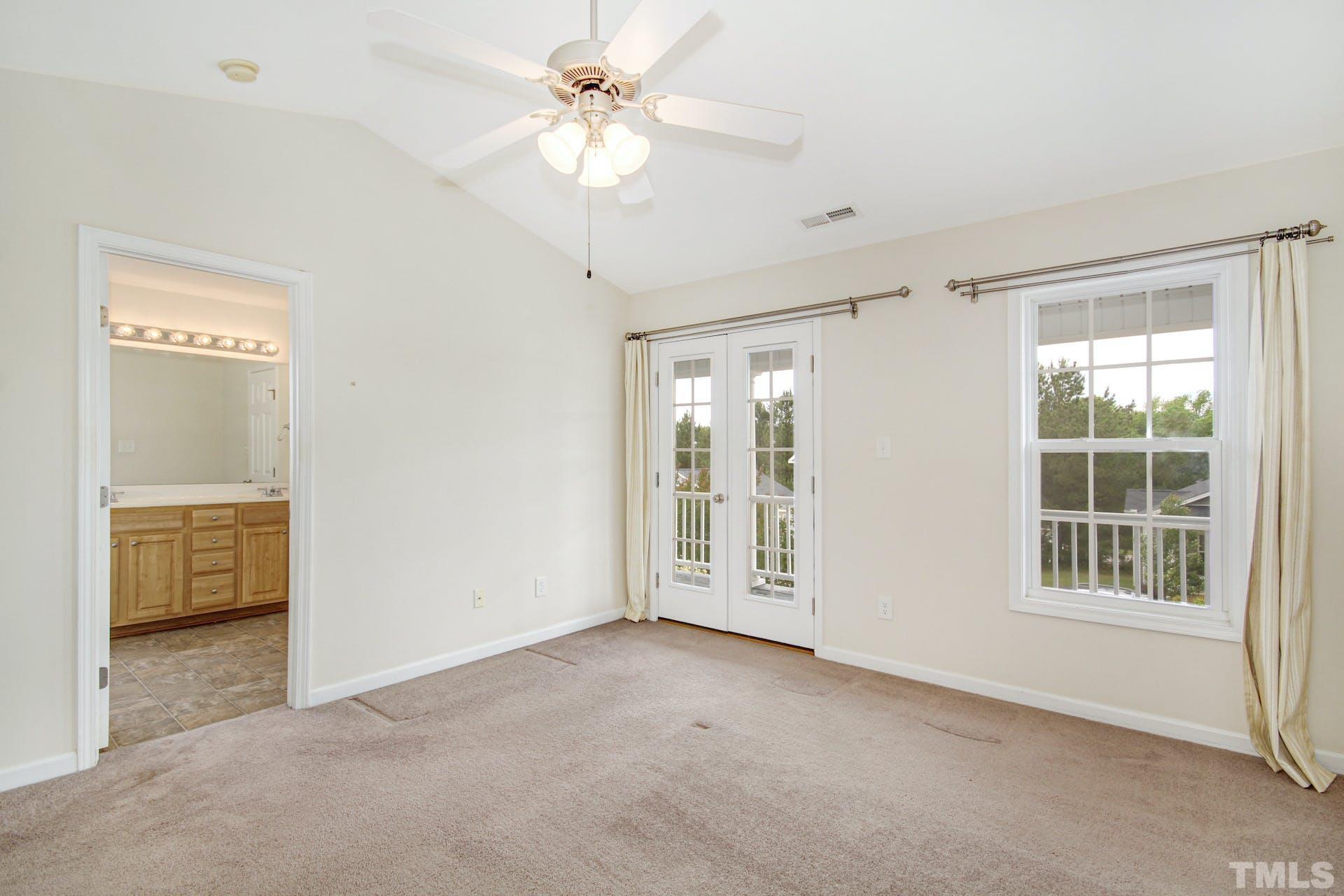 5852 Wynmore Road Raleigh, NC 27610 - Photo 15 of 25 a view of an empty room with a window