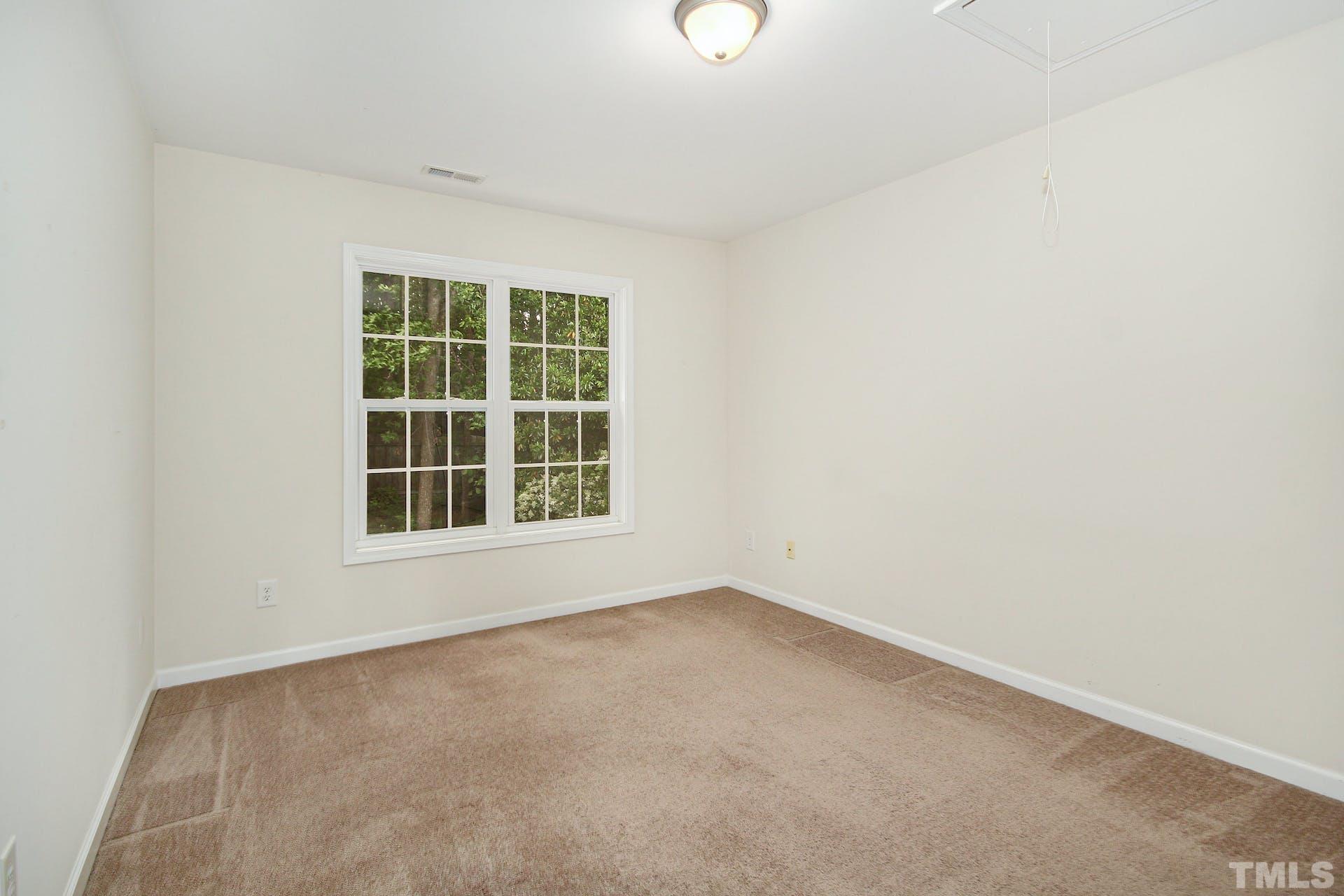 5852 Wynmore Road Raleigh, NC 27610 - Photo 17 of 25 an empty room with a window