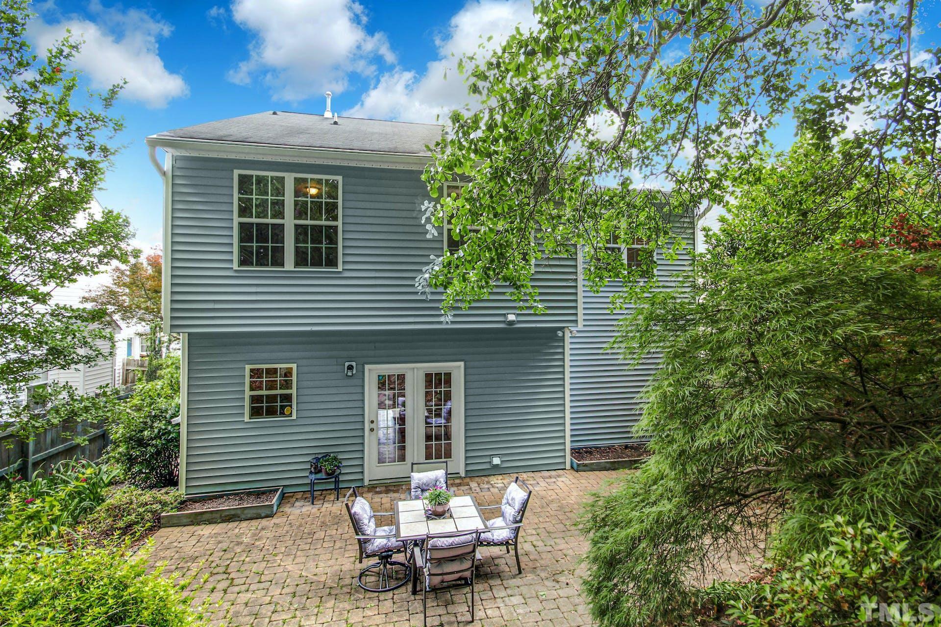 5852 Wynmore Road Raleigh, NC 27610 - Photo 25 of 25 a backyard of a house with outdoor seating