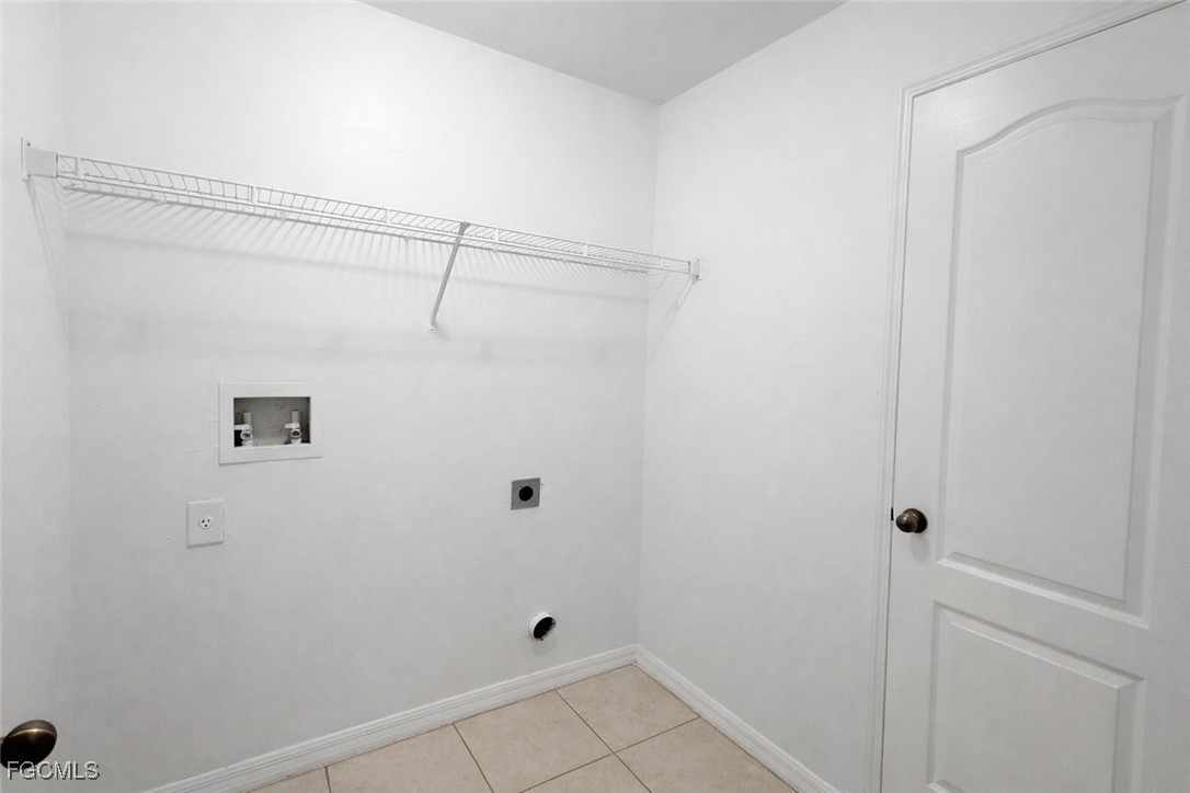 3215 13th Street Southwest Lehigh Acres, FL 33976 - Photo 11 of 12 a bathroom with a shower