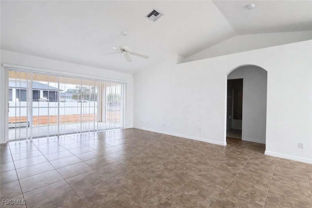 3215 13th Street Southwest Lehigh Acres, FL 33976 - Photo 6 of 12 wooden floor in an empty room with a window