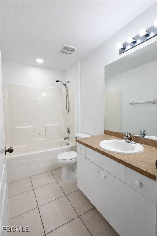 3215 13th Street Southwest Lehigh Acres, FL 33976 - Photo 8 of 12 a bathroom with a granite countertop sink a toilet a mirror a bathtub and shower