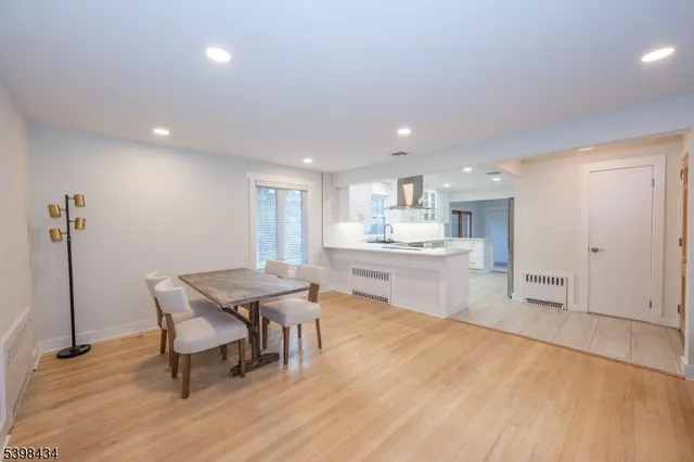 a kitchen with a table and chairs in it