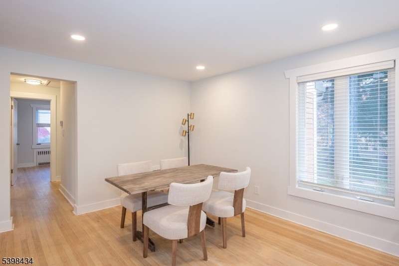 7 Oak Tree Lane Little Falls, NJ 07424 - Photo 12 of 46 a view of a dining room with furniture window and wooden floor