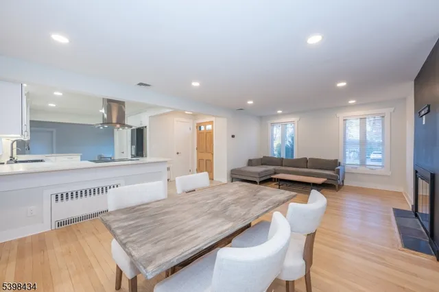 a kitchen with stainless steel appliances granite countertop a stove and a view of kitchen