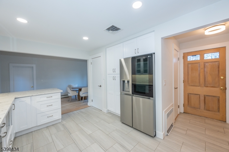 7 Oak Tree Lane Little Falls, NJ 07424 - Photo 14 of 46 a room with a dresser and mirror