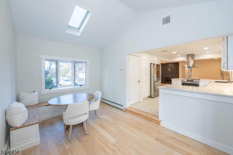 7 Oak Tree Lane Little Falls, NJ 07424 - Photo 18 of 46 a living room with furniture and a wooden floor