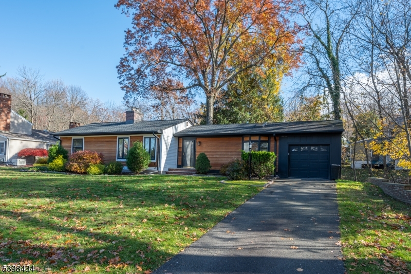 7 Oak Tree Lane Little Falls, NJ 07424 - Photo 2 of 46 a front view of house with yard and green space